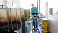 Swiss soldier Antoine Schuerch of the Hospital Battalion 2 of the Swiss army moves equipment during a media visit of the deployment at Pourtales Hospital during the coronavirus disease (COVID-19) outbreak in Neuchatel, Switzerland, March 25, 2020. REUTERS