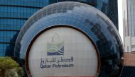FILE PHOTO: The logo of Qatar Petroleum is seen at its headquartes in Doha, Qatar, July 8, 2017. REUTERS/Stringer/File Photo
