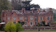 Armed Police officers are seen on the grounds of Chequers, the Prime Minister's official country residence, after British Prime Minister Boris Johnson was discharged from hospital on Sunday recovering from coronavirus disease (COVID-19), Aylesbury, Britai
