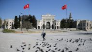 Beyazit Square which is one of the most tourist attraction places, and its surroundings are seen empty with a flock of pigeons due to precautionary measures taken against the novel coronavirus (COVID-19) pandemic in Istanbul, Turkey on April 28, 2020. ( E