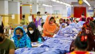 Women work in a garment factory, as factories reopened after the government has eased the restrictions amid concerns over coronavirus disease (COVID-19) outbreak in Dhaka, Bangladesh, May 3, 2020. REUTERS/Mohammad Ponir Hossain