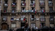 Inhabitants applaud at 20:00 along with others across the French nation, to show their support to healthcare employees in Saint-Mande, a Paris' suburb, on May 4, 2020 during the 49th day of a lockdown in France aimed at curbing the spread of the COVID-19 