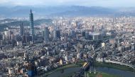 FILE PHOTO: Nan Shan Plaza (L) and Taiwan's landmark building Taipei 101 are pictured through the window of an airplane, in Taipei, Taiwan August 19, 2018. REUTERS/Tyrone Siu/File Photo
