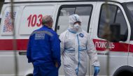 MOSCOW, RUSSIA - MAY 7: Patients suspected of the coronavirus (COVID-19) infection are being brought to Kommunarka Hospital with an ambulance accompanied by health officials wearing protective suits in Moscow, Russia on May 7, 2020. ( Sefa Karacan - Anado