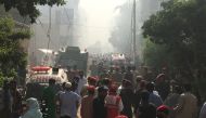 Ambulances and fire brigade vehicles gather at the site of a passenger plane crash in a residential area near an airport in Karachi, Pakistan May 22, 2020. REUTERS/Akhtar Soomro

