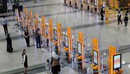 Pegasus Airlines self check-in counters are seen at the nearly empty domestic departure terminal of the Sabiha Gokcen Airport, following the coronavirus disease (COVID-19) outbreak, in Istanbul, Turkey June 11, 2020. REUTERS/Murad Sezer