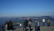 Tourists take in the view at a Three Sisters rock formation lookout in Blue Mountains National Park in the wake of regional travel re-opening as the coronavirus disease (COVID-19) restrictions are eased in New South Wales, in Katoomba, Australia, June 5, 