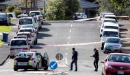 Police officers cordon off an area after a shooting incident in a residential neighbourhood in Auckland on June 19, 2020. An unarmed New Zealand police officer was shot dead on an Auckland street on June 19 in a rare fatal attack that Prime Minister Jacin