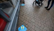 Social distancing markings are seen outside a Greggs bakery shop, as it reopens following the outbreak of the coronavirus disease (COVID-19), in Newcastle-under-Lyme, Staffordshire, Britain June 18, 2020. REUTERS/Carl Recine