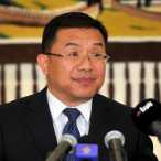 H E Zhou Jian