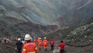 This handout from the Myanmar Fire Services Department taken and released on July 2, 2020 shows rescuers attempting to locate survivors after a landslide at a jade mine in Hpakant, Kachin state. AFP PHOTO / MYANMAR FIRE SERVICES DEPARTMENT 