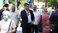 Croatian Prime Minister and the leader of Croatian Democratic Union (HDZ) Andrej Plenkovic waves as he arrives to cast his ballot during parliamentary election, amid the spread of the coronavirus disease (COVID-19), in Zagreb, Croatia, July 5, 2020. REUTE