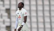 In this file photo taken on July 10, 2020 England's Jofra Archer reacts on the third day of the first Test cricket match between England and the West Indies at the Ageas Bowl in Southampton, southwest England. / AFP / POOL / Mike Hewitt /