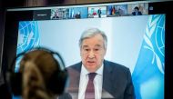 United Nations Secretary-General Antonio Guterres is seen on a video screen during a virtual climate summit, known as the Petersberg Climate Dialogue, in Berlin on April 28, 2020. Michael Kappeler/Pool via REUTERS/File Photo