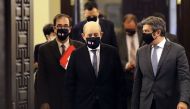French Foreign Minister Jean-Yves Le Drian (C) wears a face mask with the Lebanese and French flags as he arrives at the governmental palace in Beirut for a meeting with the Lebanese prime minister, on July 23, 2020. AFP / JOSEPH EID