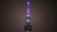 A general view shows the Tokyo Skytree illuminated in blue to pay tribute to medical workers as the city marks one year until the postponed Tokyo 2020 Olympic and Paralympic Games in Tokyo on July 23, 2020. Japan held subdued celebrations on July 23 to ma