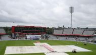 England v West Indies - Emirates Old Trafford, Manchester, Britain - July 27, 2020 The umpires inspect the pitch as rain delays the start of play Martin Rickett/Pool via REUTERS
