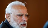 FILE PHOTO: Indian Prime Minister Narendra Modi speaks to Russian President Vladimir Putin during their meeting on the sideline of the 11th edition of the BRICS Summit, in Brasilia, Brazil November 13, 2019. Pavel Golovkin/Pool via REUTERS/File Photo