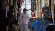 FILE PHOTO: A worker from Bharatiya Jain Sanghatana, a non-governmental organization, wearing a 