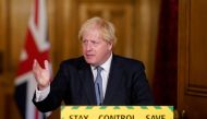  handout image released by 10 Downing Street, shows Britain's Prime Minister boris Johnson attending a remote press conference to update the nation on the novel coronavirus COVID-19 pandemic inside 10 Downing Street in central London on July 31, 2020. Bri