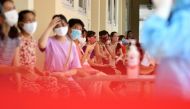 Residents wait to be tested at a makeshift rapid testing centre as Vietnam records a rise in cases of the COVID-19 coronavirus in Hanoi on July 31, 2020.  AFP / Manan VATSYAYANA

