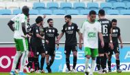 Al Sadd's Hassan Al Haydos (centre) is congratulated by team-mates after he scored a goal against Al Ahli.