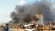 A picture shows the scene of an explosion at the port in Beirut on August 4, 2020. Two huge explosion rocked the Lebanese capital Beirut, wounding dozens of people, shaking buildings and sending huge plumes of smoke billowing into the sky. Lebanese media 