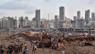 A picture shows the scene of an explosion near the the port in the Lebanese capital Beirut on August 4, 2020. Two huge explosion rocked the Lebanese capital Beirut, wounding dozens of people, shaking buildings and sending huge plumes of smoke billowing in