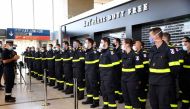 French colonel Stanislas Rouqueyrol (L) delivers a speech to personnel of French Securite Civile (Civil Security) in Roissy airport, near Paris, on August 5, 2020. AFP / Bertrand GUAY
