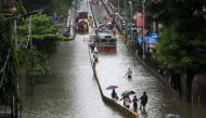 MUMBAI, INDIA - AUGUST 4: People make their way through a flooded road due to heavy monsoon rain in Mumbai, India on August 4, 2020. ( Imtiyaz Shaikh - Anadolu Agency )
