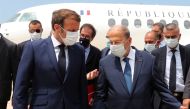 Lebanon's President Michel Aoun welcomes French President Emmanuel Macron upon his arrival at the airport in Beirut, Lebanon August 6, 2020. Dalati Nohra/Handout