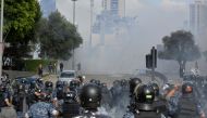 BEIRUT, LEBANON - AUGUST 08: Thousands of demonstrators clash with Lebanese riot police as riot police intervene them while they gather for a protest against government at the Martyrs' Square after the deadly explosion at the Port of Beirut led to massive