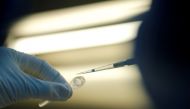 FILE PHOTO: FILE PHOTO: A scientist prepares samples during the research and development of a vaccine against the coronavirus disease (COVID-19) at a laboratory of BIOCAD biotechnology company in Saint Petersburg, Russia June 11, 2020. REUTERS/Anton Vagan