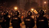 Opposition supporters protest after polls closed in Belarus' presidential election, in Minsk on August 9, 2020. / AFP / Siarhei LESKIEC