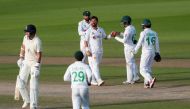 Cricket - First Test - England v Pakistan - Emirates Old Trafford, Manchester, Britain - August 8, 2020 Pakistan's Yasir Shah celebrates the wicket of England's Stuart Broad with teammates, as play resumes behind closed doors following the outbreak of the