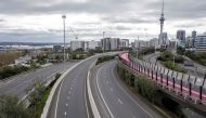 The normally busy central motorway interchange is deserted mid-morning in Auckland, New Zealand on August 14, 2020. Auckland on August 14, 2020.  / AFP / DAVID ROWLAND
