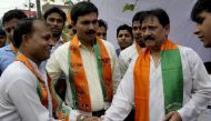 In this file photo taken on April 06, 2009 former Indian cricketer and Bharatiya Janta Party (BJP) candidate from east Delhi Chetan Chauhan (R) shakes hands with party workers as he campaigns for the forthcoming general elections in New Delhi. India's for