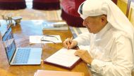 Sheikh Faisal bin Qassim Al Thani, Chairman of Aamal Company, signing the agreement of the contract in Doha, yesterday. 
