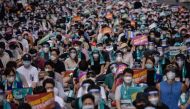Doctors, medical students and healthcare professionals wearing face masks and protective equipment as part of preventative measures against the COVID-19 coronavirus attend a rally to protest against a government proposal to increase its annual intake of m