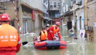 Rescue workers evacuate a resident stranded by floodwaters following heavy rainfall in Neijiang of Sichuan province, China August 18, 2020. China Daily via REUTERS