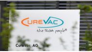In this file photo taken on June 23, 2020 The logo of the biopharmaceutical company CureVac is seen in front of the company's headquarters in Tuebingen, southern Germany on June 23, 2020. / AFP / THOMAS KIENZLE