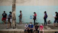 Filipinos wait to get tested for the coronavirus disease (COVID-19) at a government facility in Caloocan, Metro Manila, Philippines, August 18, 2020. REUTERS/Eloisa Lopez