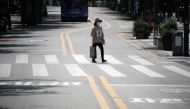 A woman wearing a mask to prevent the spread of the coronavirus disease (COVID-19) walks in a shopping district in Seoul, South Korea, August 20, 2020. REUTERS/Kim Hong-Ji