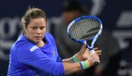 In this file photo taken on February 17, 2020, Kim Clijsters of the Belgium returns the ball to Garbine Muguruza of Spain during the WTA Dubai Duty Free Tennis Championship, at the Dubai Tennis Stadium in the United Arab Emirates. Kim Clijsters suffered a