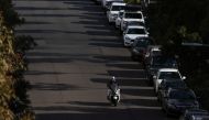 A delivery courier drives down an empty street as the state of New South Wales continues to report low numbers for new daily cases of the coronavirus disease (COVID-19) in Sydney, Australia, August 21, 2020. REUTERS/Loren Elliott