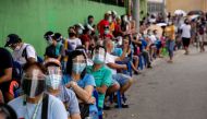 Filipinos queue for cash subsidy from the government amid the coronavirus disease (COVID-19) outbreak, in Batasan Hills, Quezon City, Metro Manila, Philippines, August 27, 2020. REUTERS/Eloisa Lopez TPX IMAGES OF THE DAY