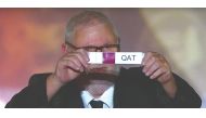 An official picks Qatar during the draw ceremony yesterday.