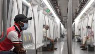 Commuters sit in a carriage of a Yellow Line train after Delhi Metro Rail Corporation (DMRC) resumed services following its closure due to the Covid-19 Coronavirus pandemic in New Delhi on September 7, 2020. / AFP / Prakash SINGH