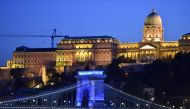 As part of a conference about the live events in the coronavirus situation, the oldest Hungarian bridge, the 'Lanchid' (Chain Bridge) is illuminated by blue light in Budapest on September 9, 2020. The conference, the 'Power of live events' will be held in