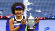 Naomi Osaka of Japan celebrates with the trophy after winning her Women's Singles final match against Victoria Azarenka of Belarus on Day Thirteen of the 2020 US Open at the USTA Billie Jean King National Tennis Center on September 12, 2020 in the Queens 